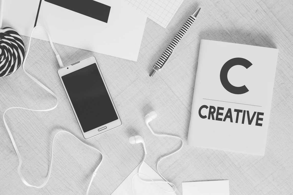 Lay of mockup phone and creative note book